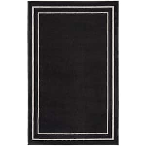 Nourison Essentials Black Ivory 2 ft. x 4 ft. Solid Contemporary Area Rug