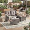Outdoor living space with wicker seating and ottomans.