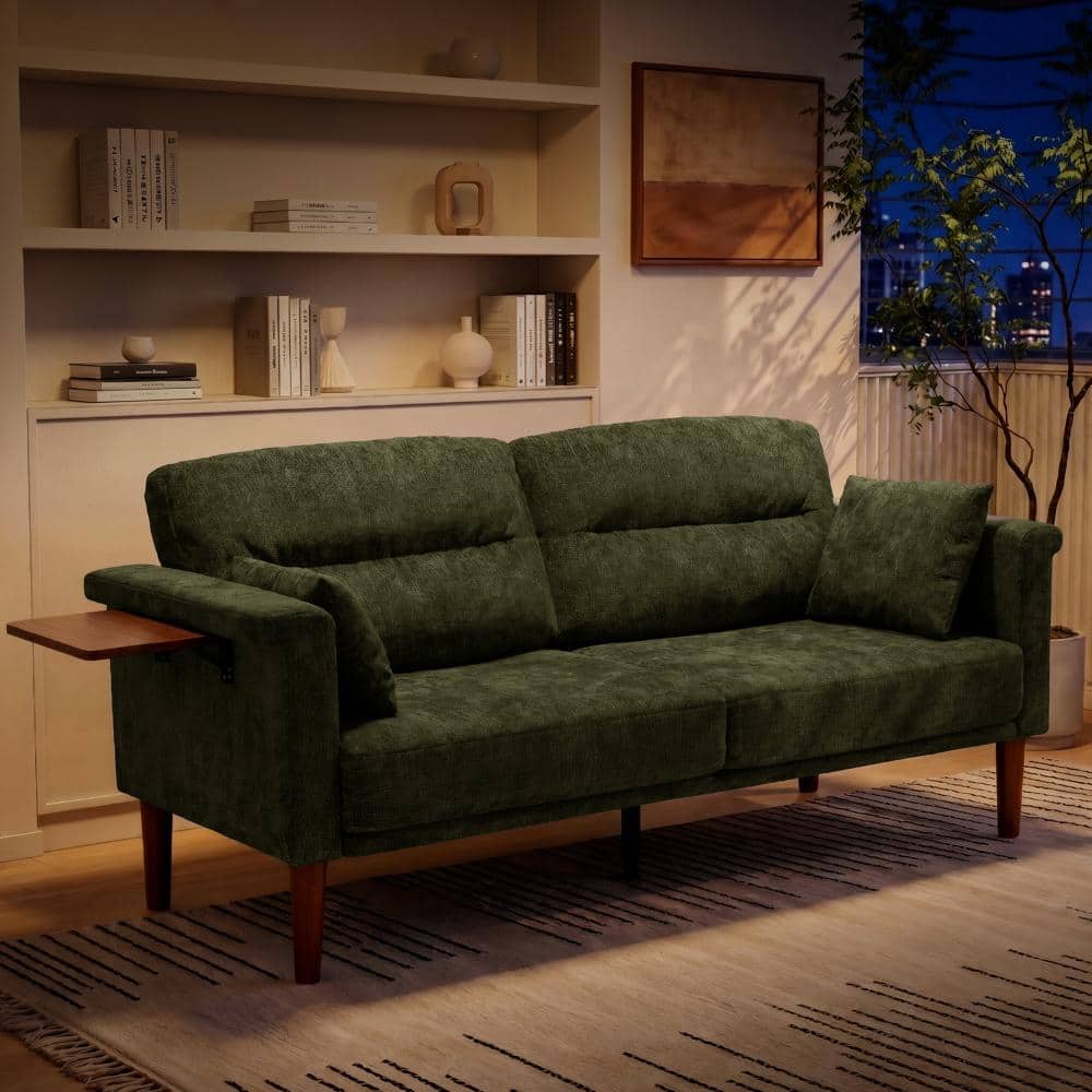 Green loveseat sofa in a modern living room.