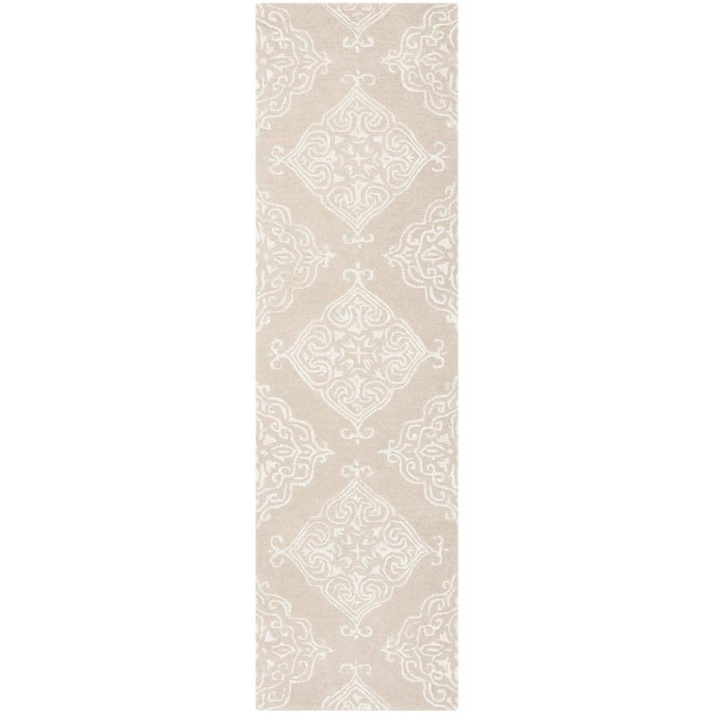 https://images.thdstatic.com/productImages/0c4b4e28-b9fd-4702-bbcb-f0f3b04784b6/svn/beige-ivory-safavieh-area-rugs-glm568e-28-64_1000.jpg