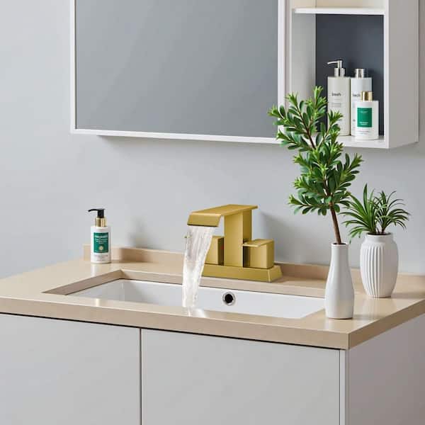 4 in. Centerset Double Handle Low Arc Bathroom Faucet with Pop-up Drain Included in Matte Gold