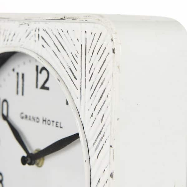 https://images.thdstatic.com/productImages/0ca11698-f3ff-4347-a601-801eea5f5182/svn/white-iron-mercana-table-clocks-69486-c3_600.jpg