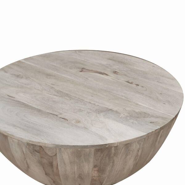 light brown mango wood coffee table in round shape