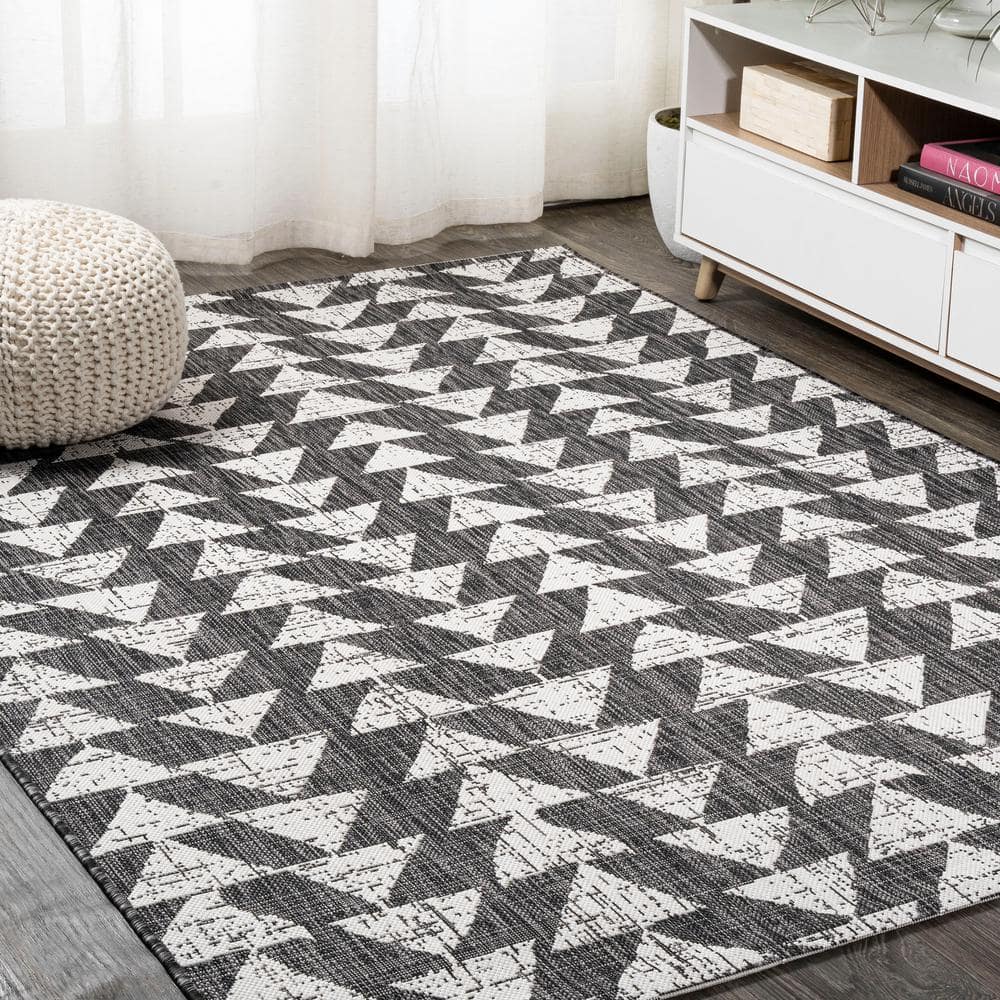 5' x 8' Black and Ivory Geometric Synthetic Area Rug
