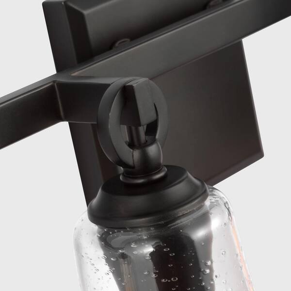 Generation Lighting - Studio Monterro 30.25 in. 3-Light Aged Iron Transitional Vanity Light with Clear Seeded Glass Shades