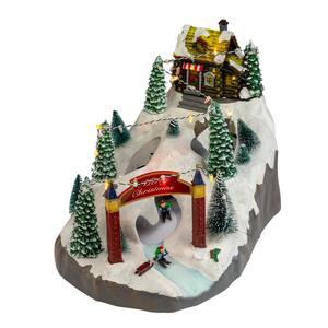 9 in. H x 15 in. W LED Animated and Lighted Christmas Scene With 3 Turning Skiers