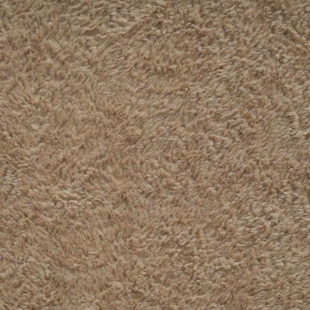 Close-up texture of brown plush fabric.
