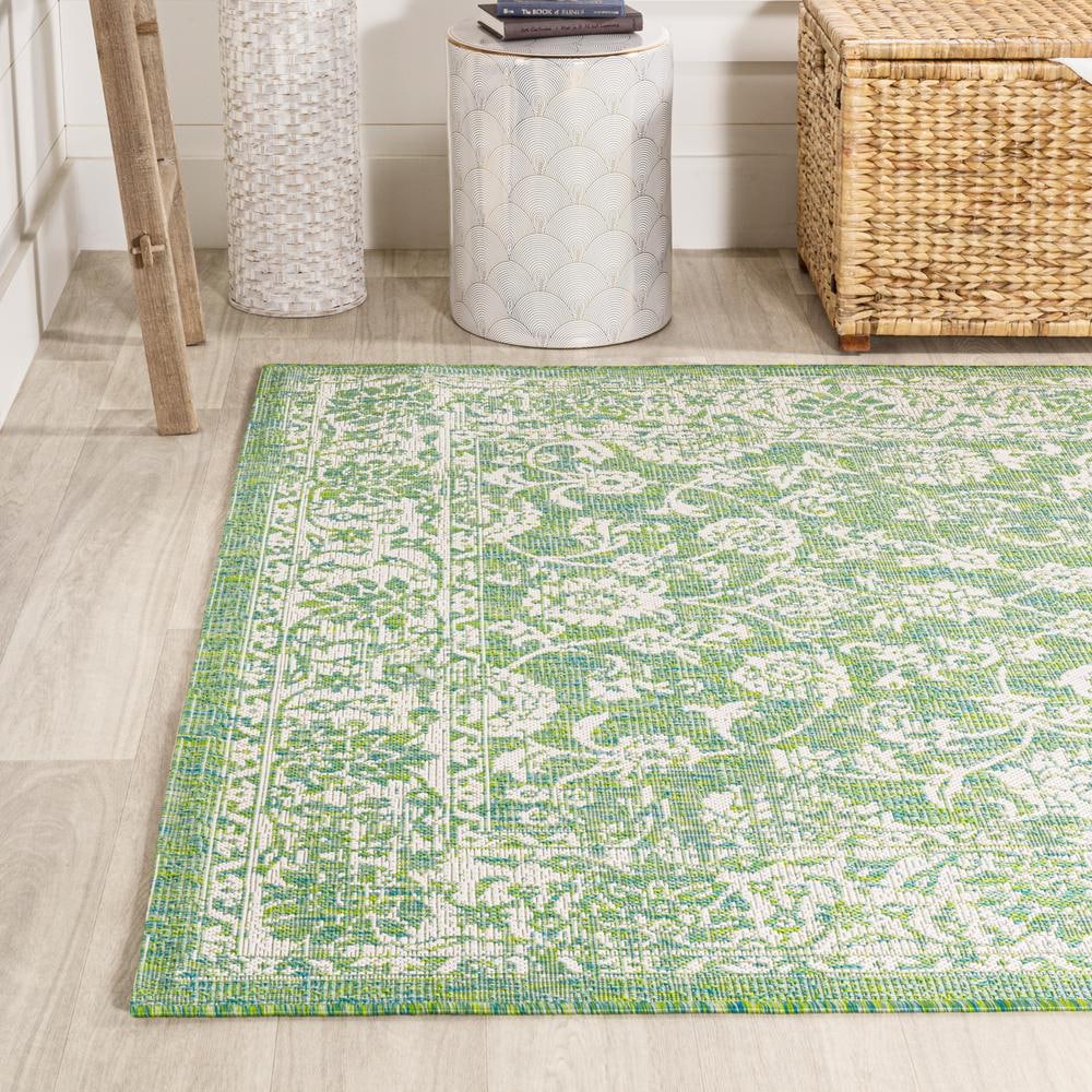 9' x 12' Green and Cream Floral Synthetic Rectangular Area Rug