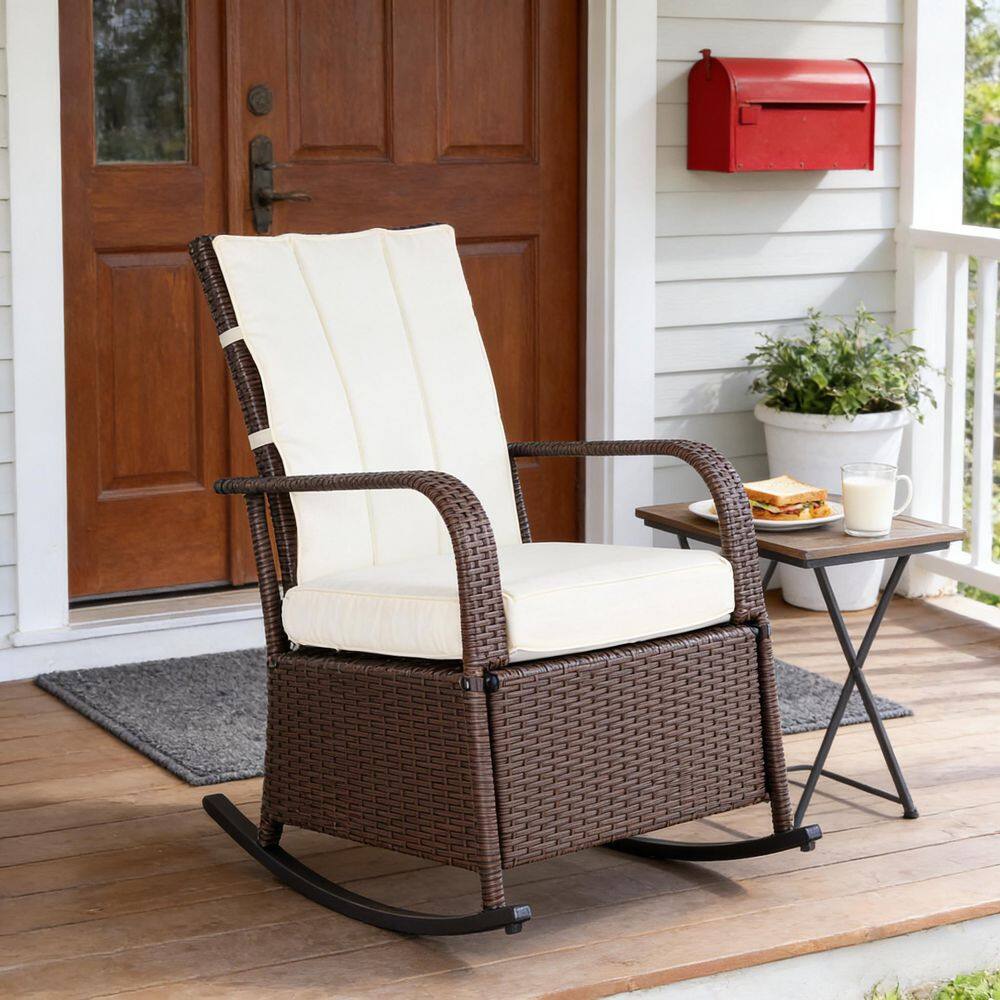 Outdoor rattan recliner chair on a wooden deck next to a house.