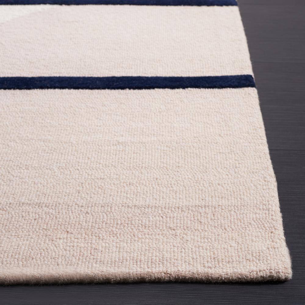 Rodeo Drive 6' x 9' Black and Orange Hand-Tufted Wool Rug