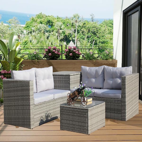 Zeus & Ruta 4-Piece Wicker Patio Conversation Set with Storage Box and Gray Cushions