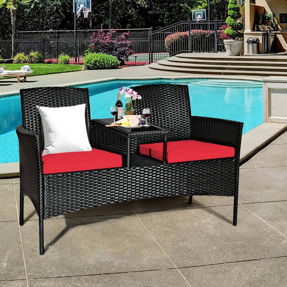 Compact Black Wicker Patio Loveseat with Red Cushions and Glass Table