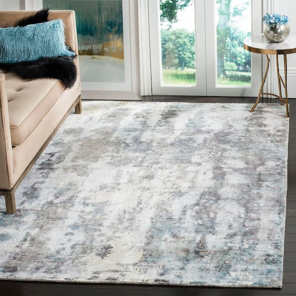 Mirage 9 ft. x 12 ft. Ivory/Blue Abstract Striped Area Rug