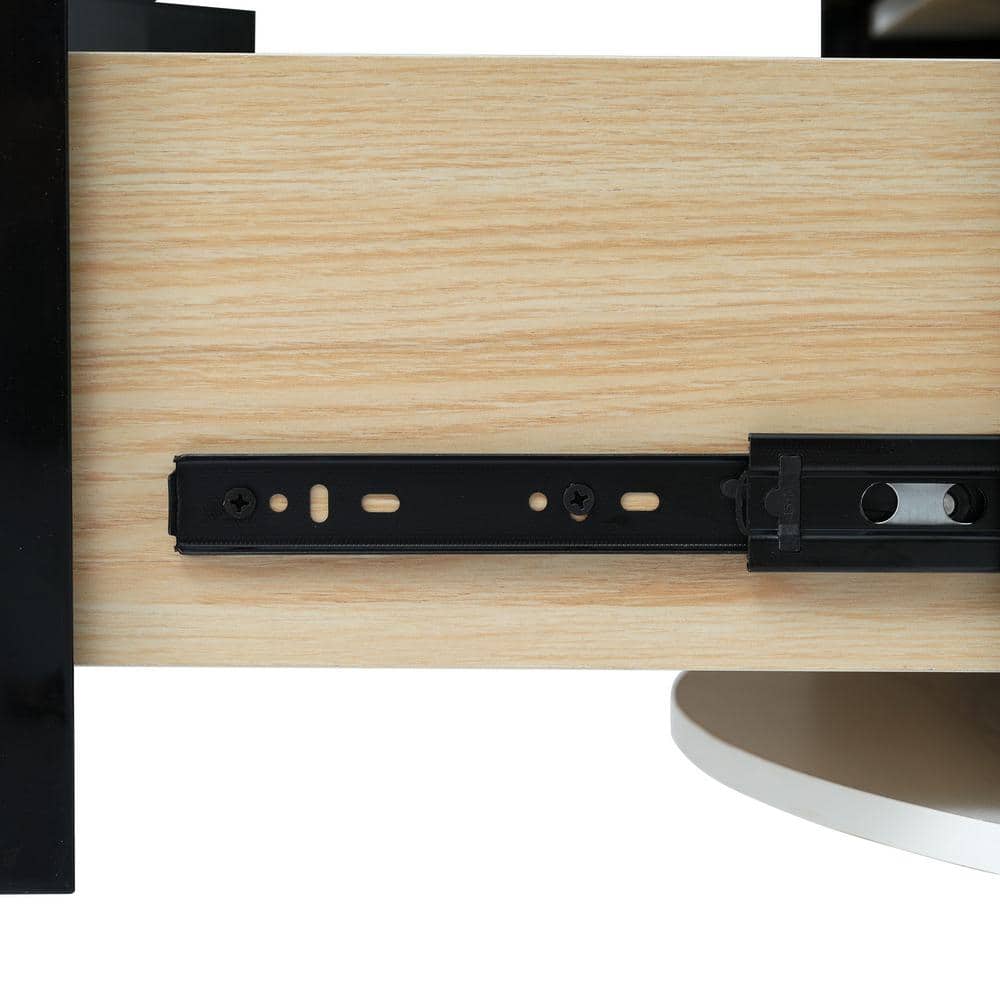Close-up of the metal drawer slide on the light wood drawer interior.