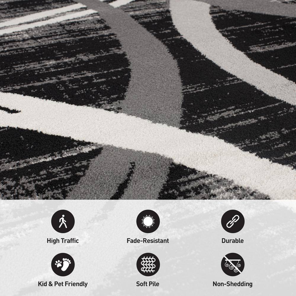 Black and Gray Abstract Synthetic 5' x 7' Area Rug