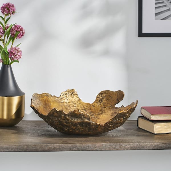https://images.thdstatic.com/productImages/0dcf9adf-d16d-518f-a1f0-0aea4649398f/svn/antique-brass-noble-house-decorative-bowls-104854-31_600.jpg