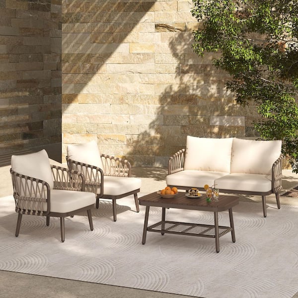 4-Piece Brown Metal Patio Conversation Set with Beige Cushions and Coffee Table