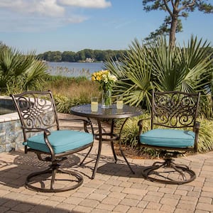 Traditions 3-Piece Outdoor Bistro Set with Round Cast-Top Table and Swivel Chairs with Blue Cushions