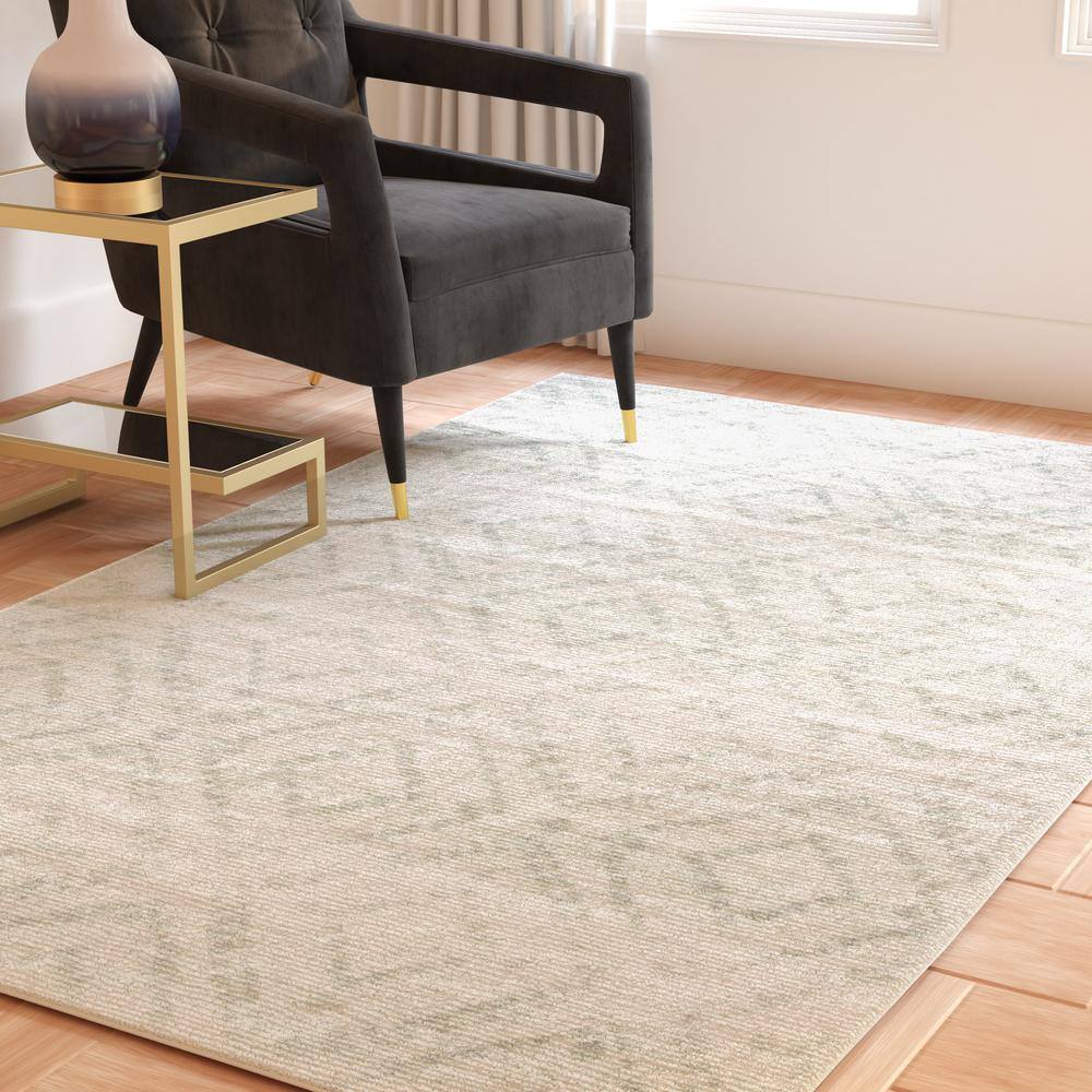 Ivory and Green Geometric 10' x 14' Synthetic Area Rug