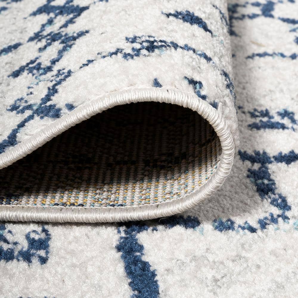 Ivory and Navy 4' x 6' Synthetic Trellis Area Rug