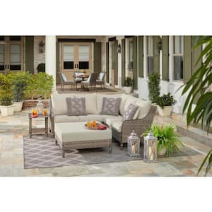 Windsor 4-Piece Brown Wicker Outdoor Patio Sectional Sofa with Ottoman and CushionGuard Biscuit Tan Cushions