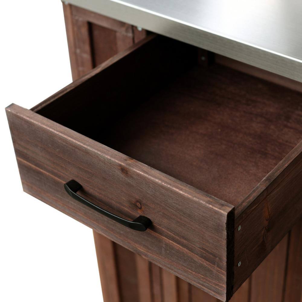 Close-up of the open storage drawer of the kitchen island