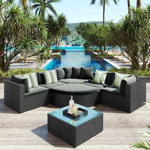7-Piece Black Wicker Outdoor Sectional Set with Striped Green Pillows and Gray Cushions