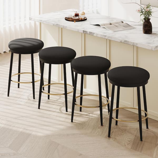 CHRISTOPHER KNIGHT HOME Alvara 24.75 in. Upholstered Metal Counter Stools with Footrest, Black + Gold, (Set of 4)