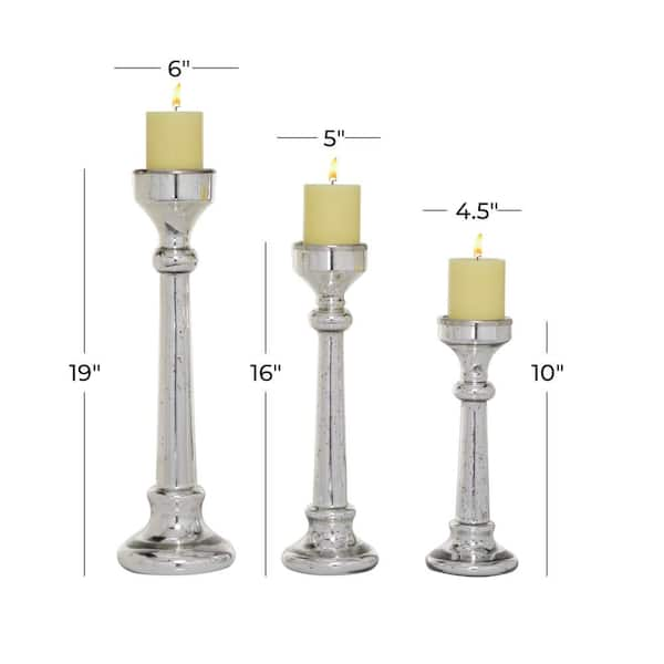 https://images.thdstatic.com/productImages/0ed1f10e-ecfa-4ee4-84fe-3b9c9e8006d7/svn/silver-candle-holders-82772-c3_600.jpg