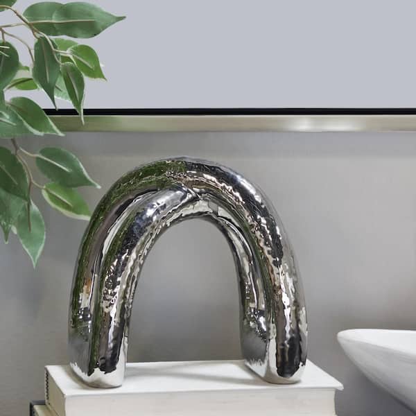 CosmoLiving by Cosmopolitan 7 in. x 8 in. Silver Porcelain Arched Abstract Sculpture