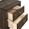 Close-up of two open drawers on a dark brown nightstand.