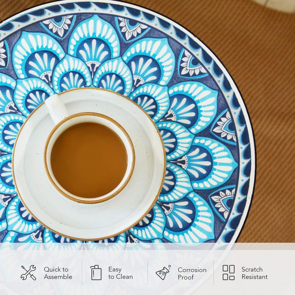 Close-up of the blue mandala mosaic tabletop with a coffee cup.