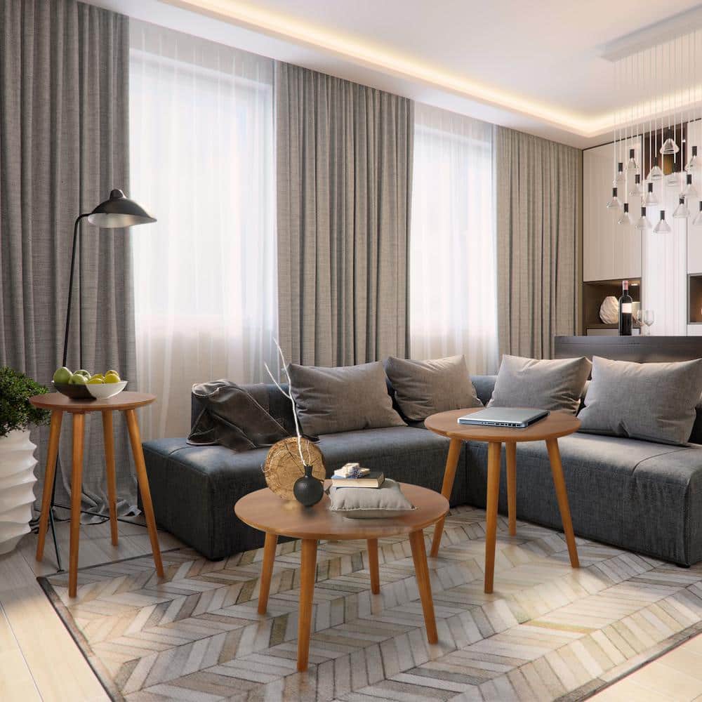 Three Mesa natural round solid wood top coffee tables in a modern living room