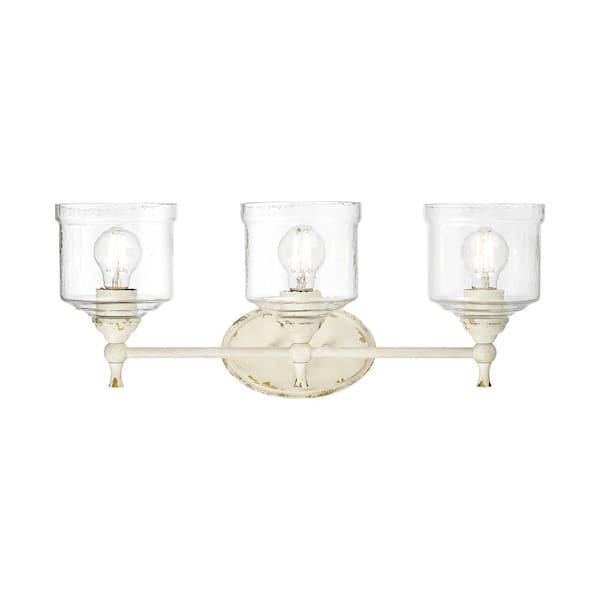 Keating 7.5 in. 3 Light Antique Ivory Vanity Light with Hammered Water Glass Shade