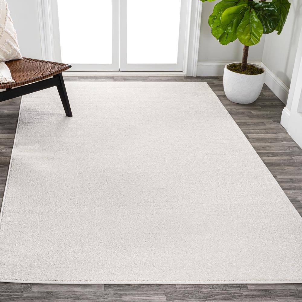 Cream Solid Synthetic Reversible 10' x 14' Area Rug