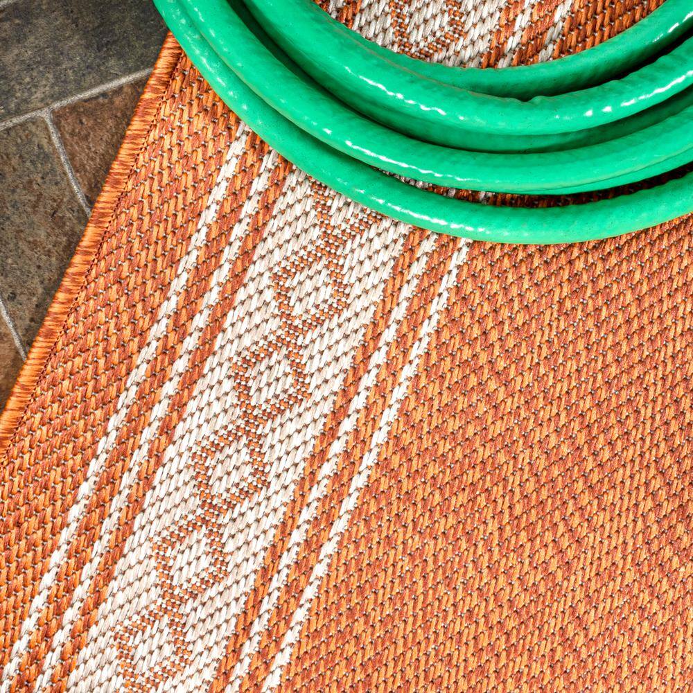 Lucia Cream and Orange Synthetic Indoor/Outdoor Area Rug