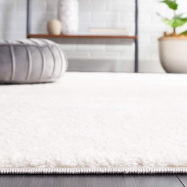 SAFAVIEH Melody Ivory 8 ft. x 10 ft. Solid Parallel Area Rug