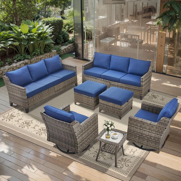 Glissia 7-Piece Gray Wicker Patio Conversation Set with Swivel Gliders and 4 in. Olefin Navy Blue Cushions
