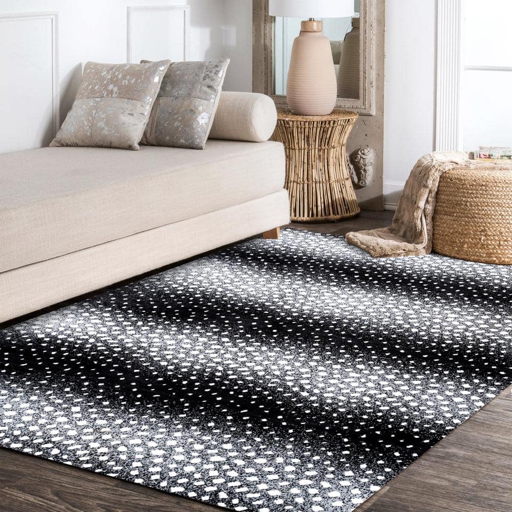 Abstract Antelope 8' x 10' Black and Ivory Synthetic Area Rug