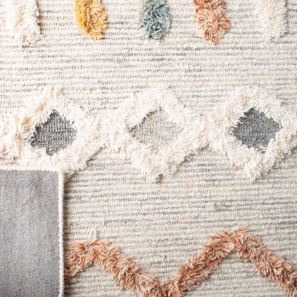 Handmade Ivory Wool Rectangular 6' x 9' Rug