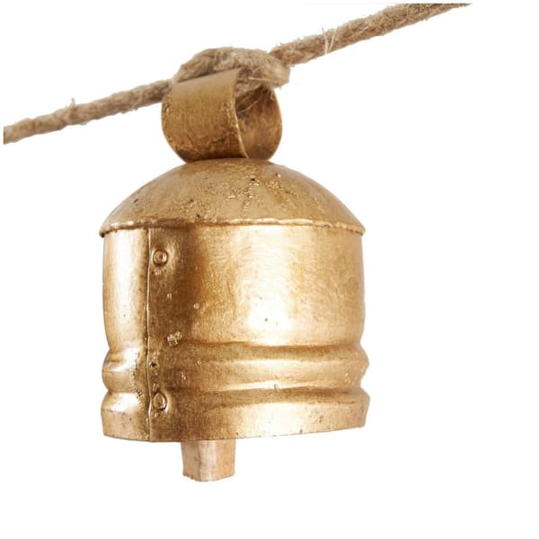 Litton Lane Gold Metal Tibetan Inspired Cylindrical Decorative Cow
