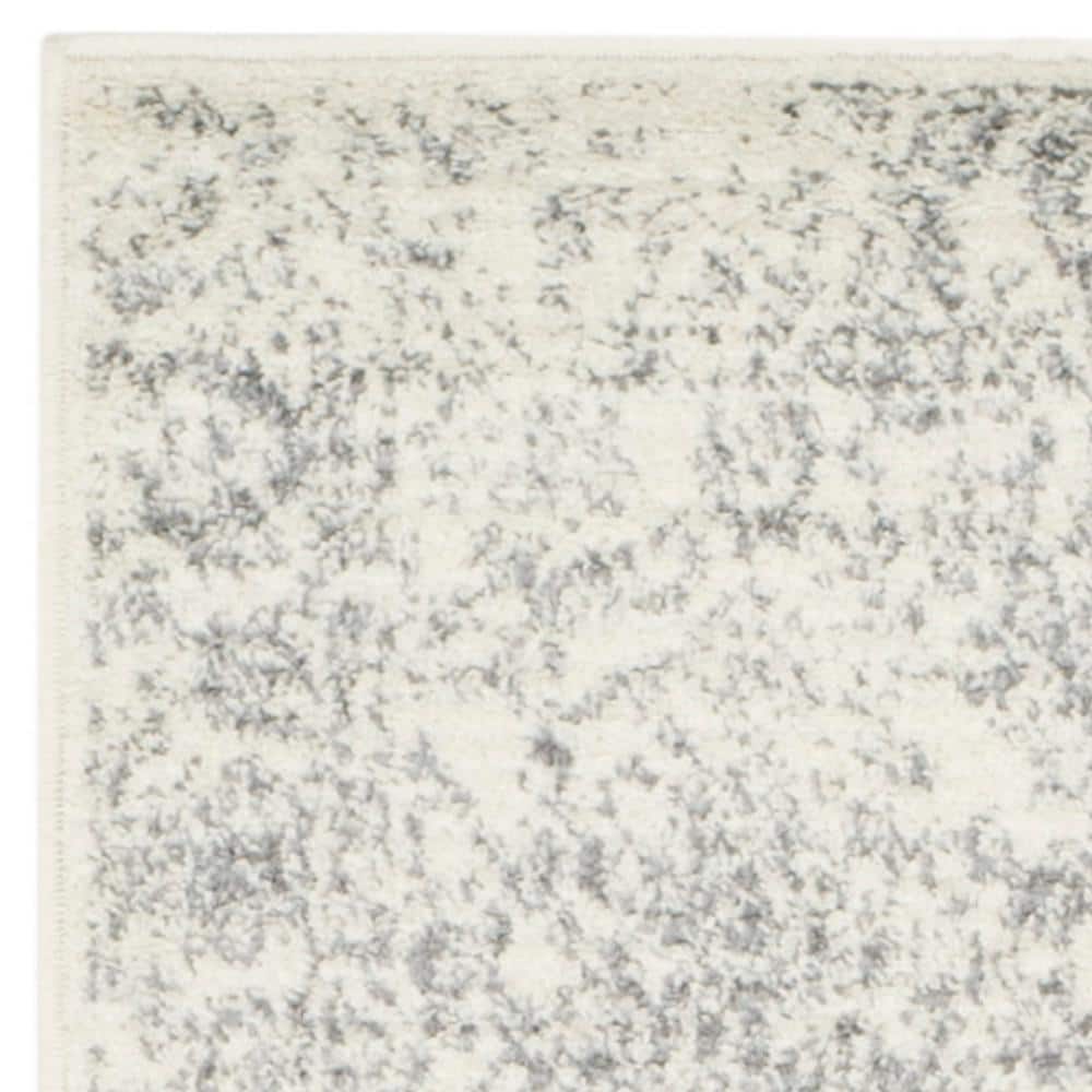 Ivory & Silver Oriental Distressed 30" Synthetic Area Rug