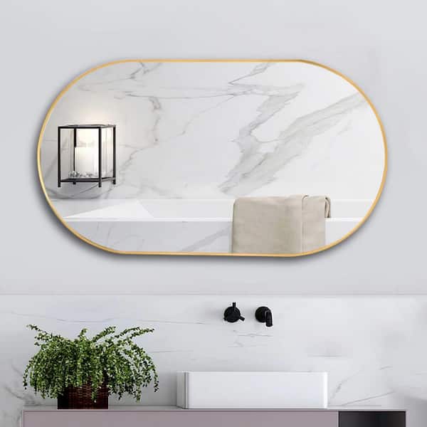 Staykiwi 36 in. W. x 18 in. H Oval Framed Wall Bathroom Vanity Mirror in Gold
