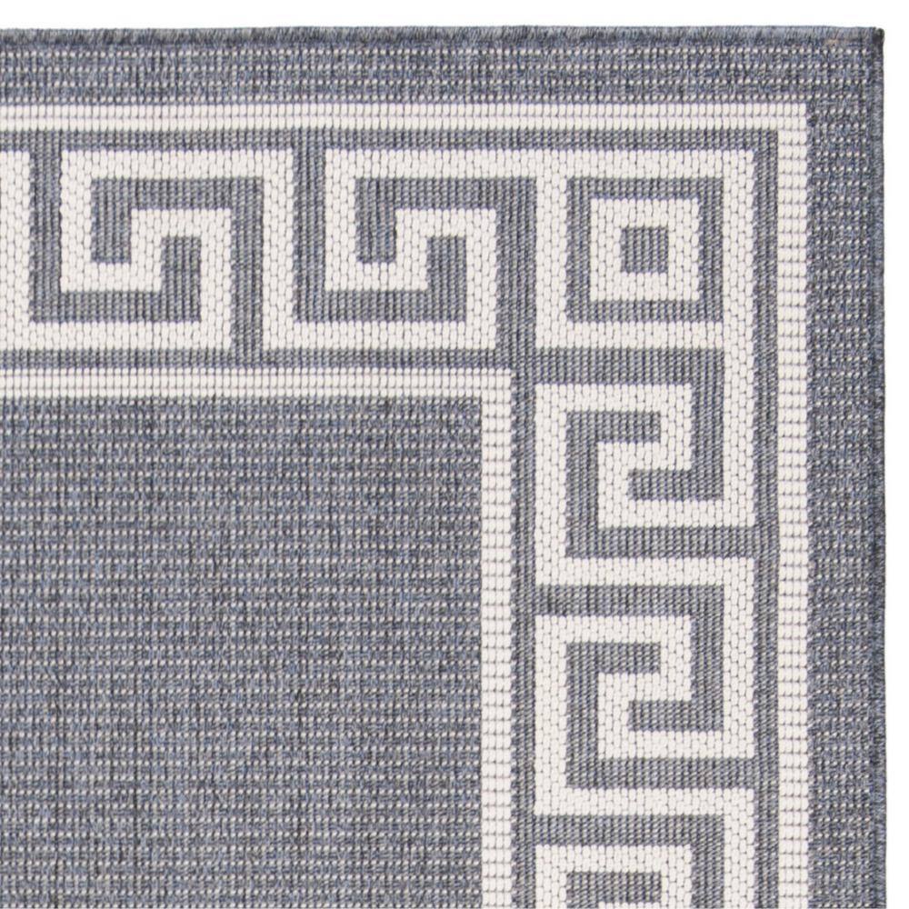 Dark Blue and Ivory Geometric 9' x 12' Synthetic Area Rug