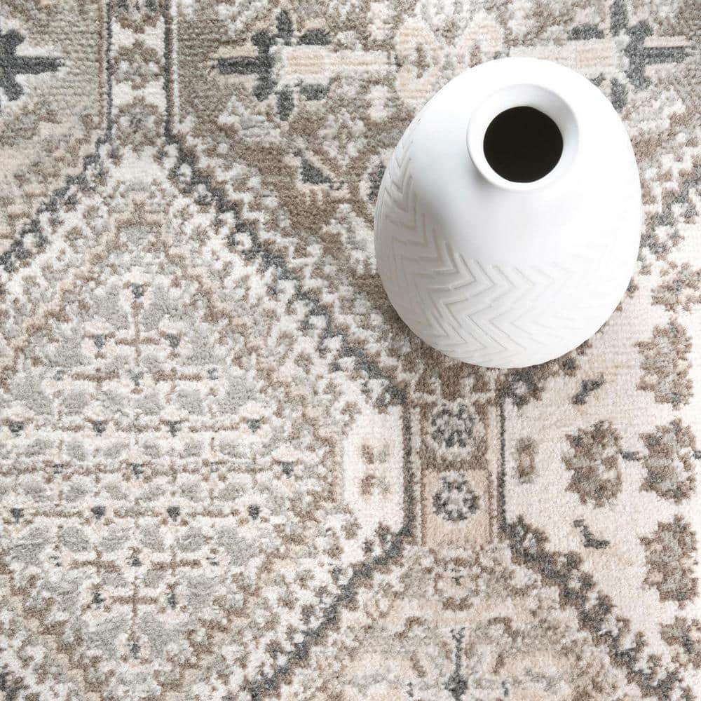 Beige Oval 6'7" x 9' Synthetic Easy-Care Area Rug