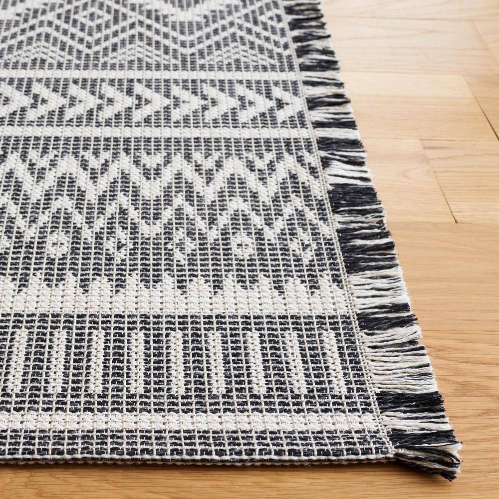 Augustine Black and Ivory Geometric Synthetic Area Rug, 6'4" x 9'6"