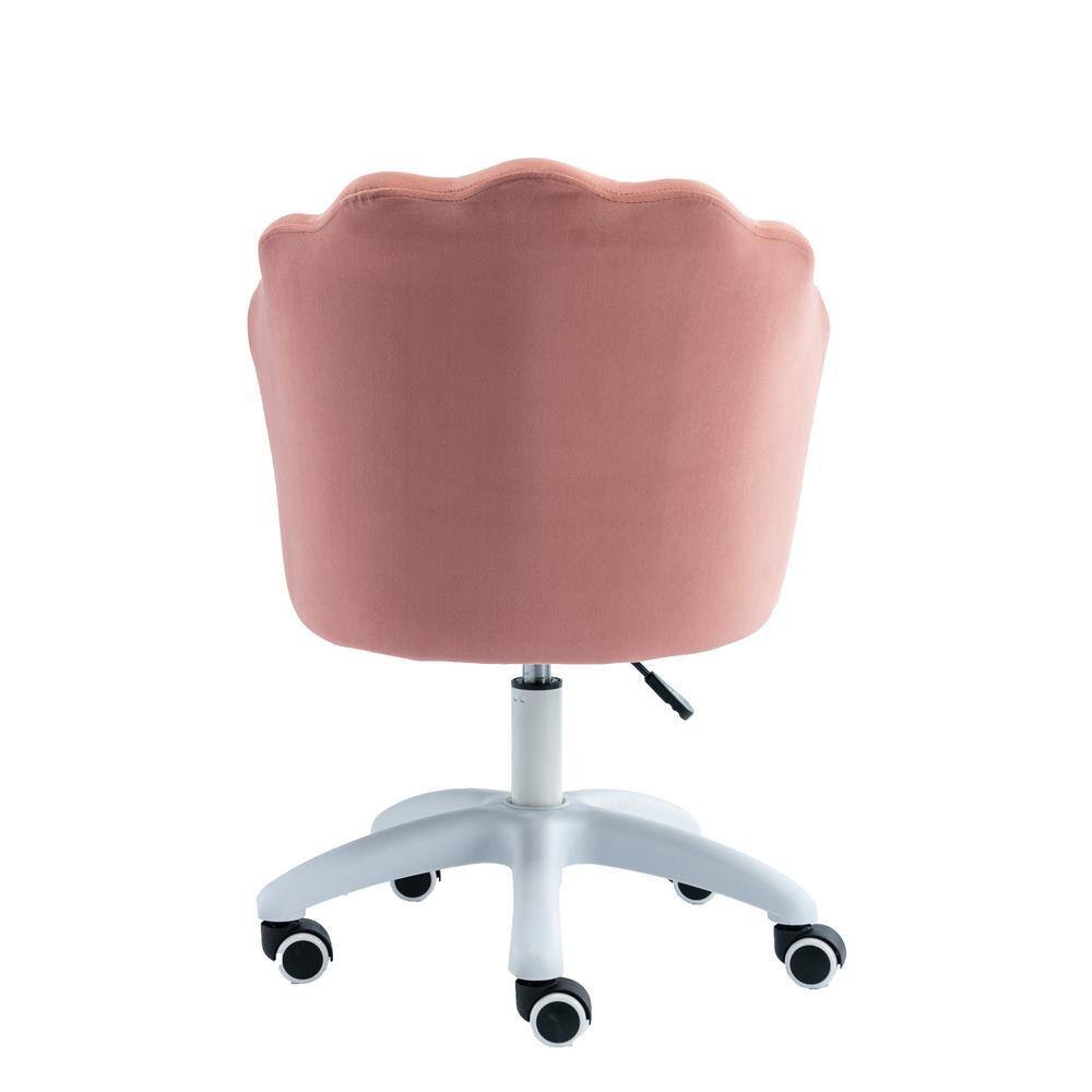Back view of a pink velvet scalloped vanity chair with a white rolling base.