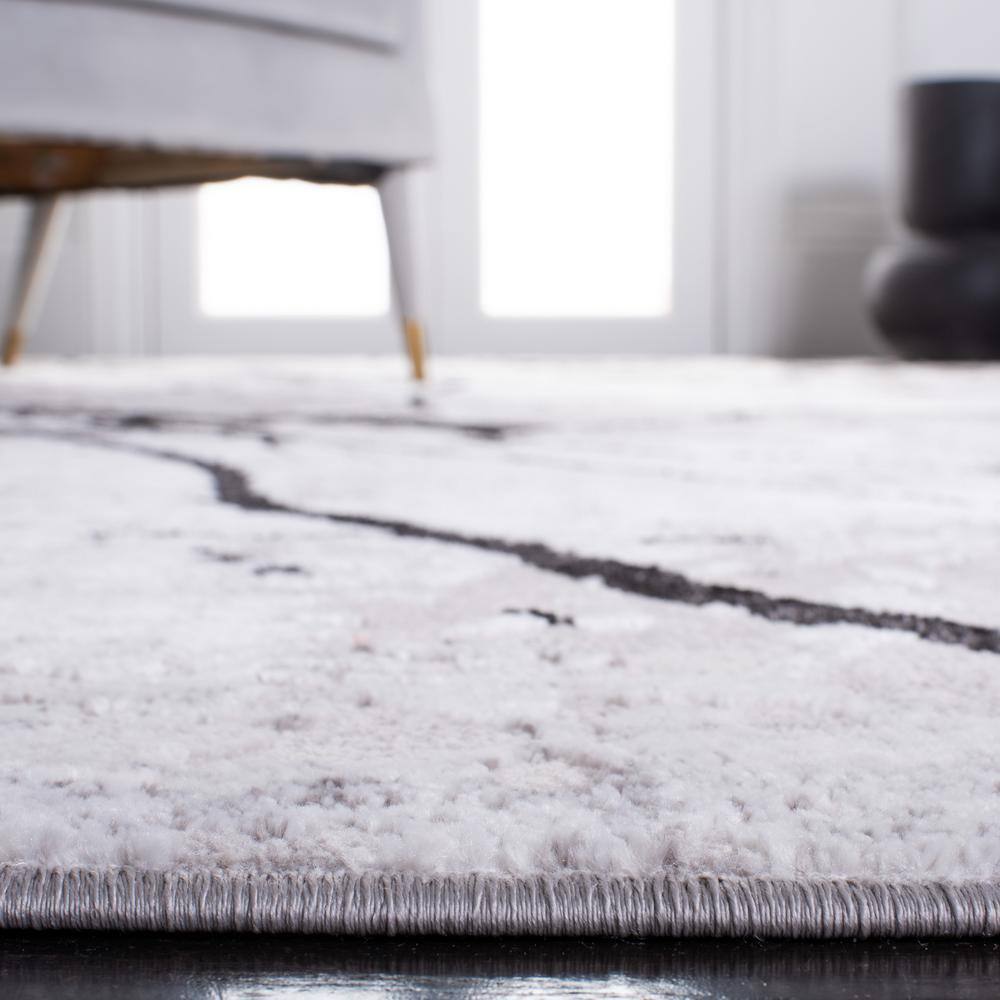 Handmade Round Gray and Black Abstract Synthetic Rug