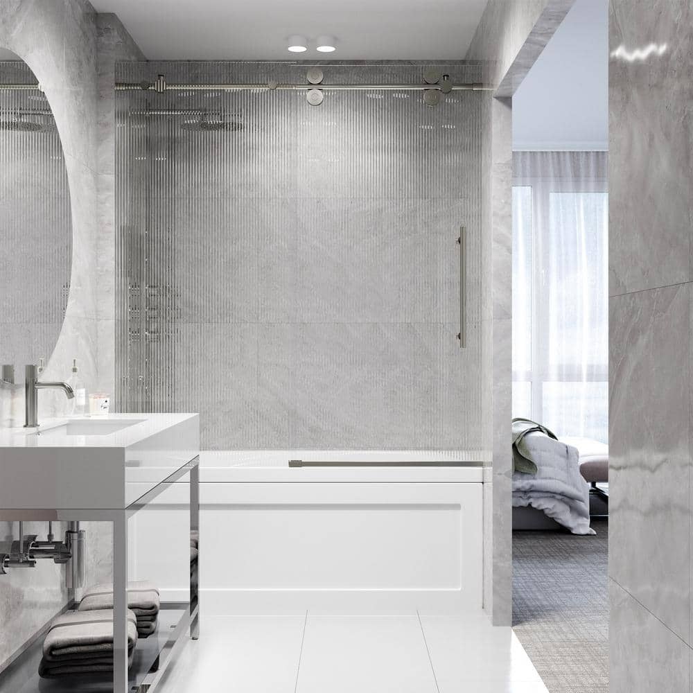 Elan Frameless Sliding Tub Door in Stainless Steel with Fluted Glass