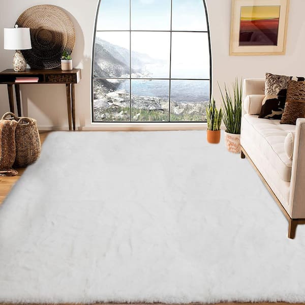 https://images.thdstatic.com/productImages/1118fee3-fb0f-4a21-820a-090c2c232957/svn/white-area-rugs-tmwrc69-e1_600.jpg